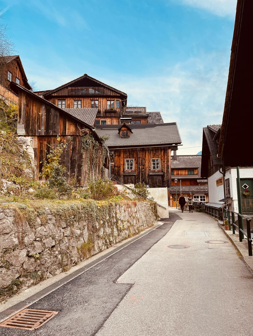 Traditional Swiss alpine village street with wooden chalets